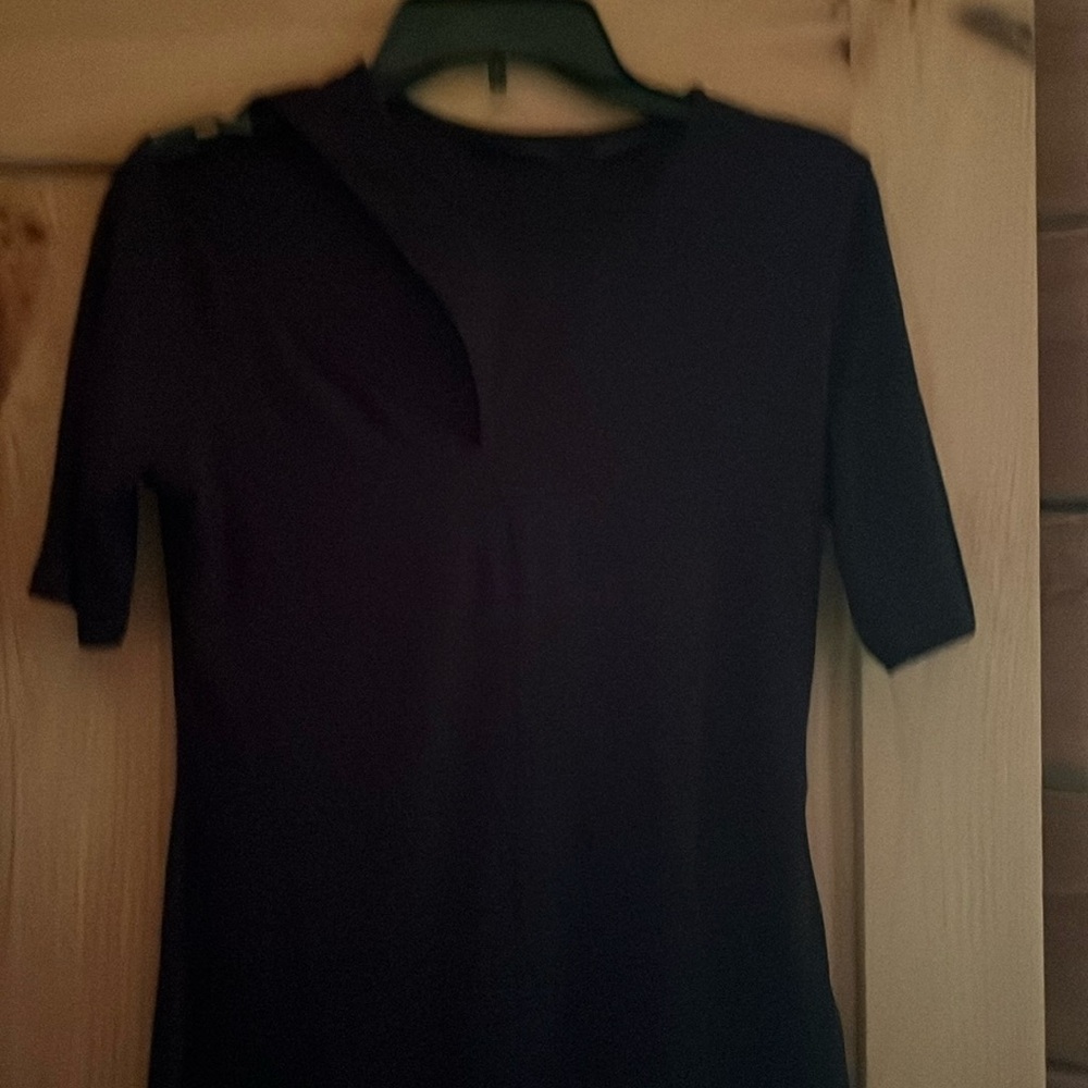 Black short sleeve top cut out on sleeve never worn